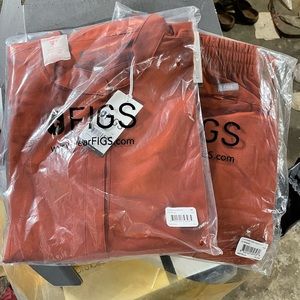 Rafael 2XL top and large jogger bottoms. Rust/orange color. Never out of bags.